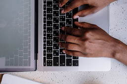 Student using computer to check their fees online